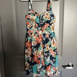 Tropical print mini dress with built in bra pads. Cute bow in front